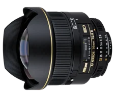 Wide-angle camera lens with black barrel and gold accents, featuring ribbed focusing ring and depth-of-field markings