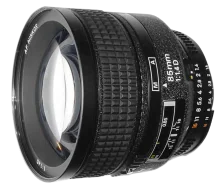 Camera lens with f/1.4 aperture and 85mm focal length, showing glass elements and focus ring