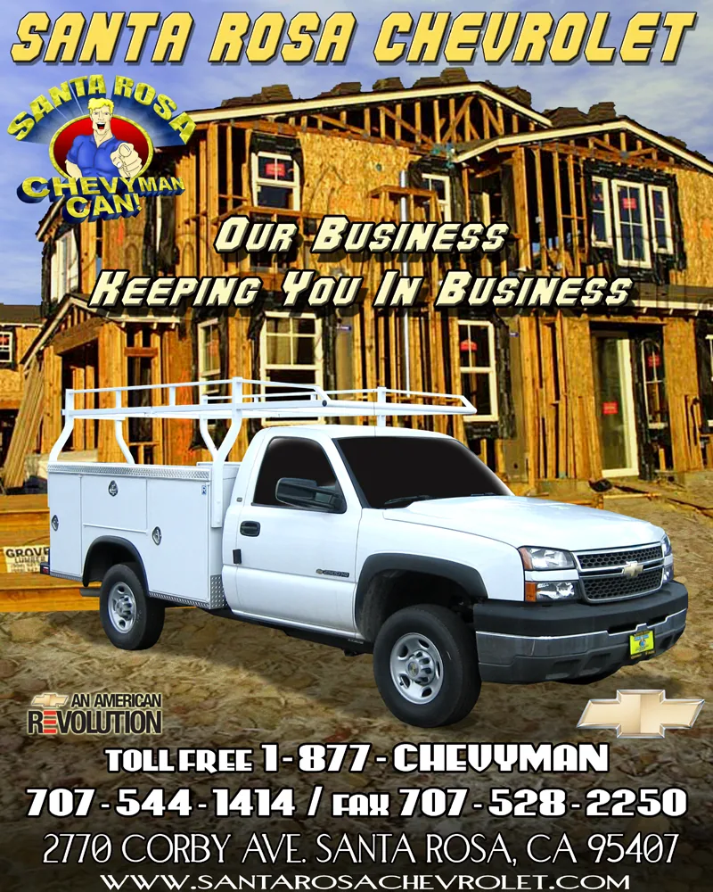 White Chevrolet pickup truck with utility bed in front of wooden building with Santa Rosa Chevrolet advertisement and contact information